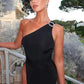 Elegant black one-shoulder evening dress with pearl embellishment, perfect for women's fashion events