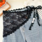 Black lace bralette with scalloped edges paired with light wash denim shorts, women's fashion