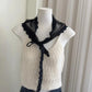 Black lace collar accessory on cream knit top, stylish women's fashion