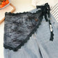 Black lace women's underwear with floral design, styled over denim shorts for fashion look