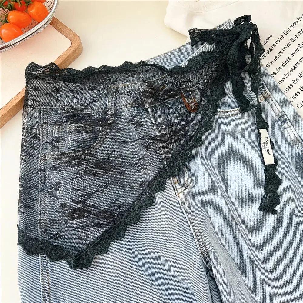 Black lace women's underwear with floral design, styled over denim shorts for fashion look