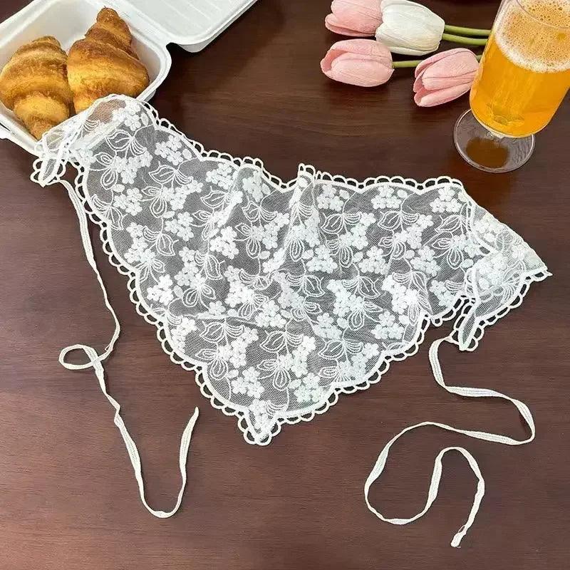 White lace floral lingerie with adjustable straps, styled with croissants and tulips for a chic fashion look