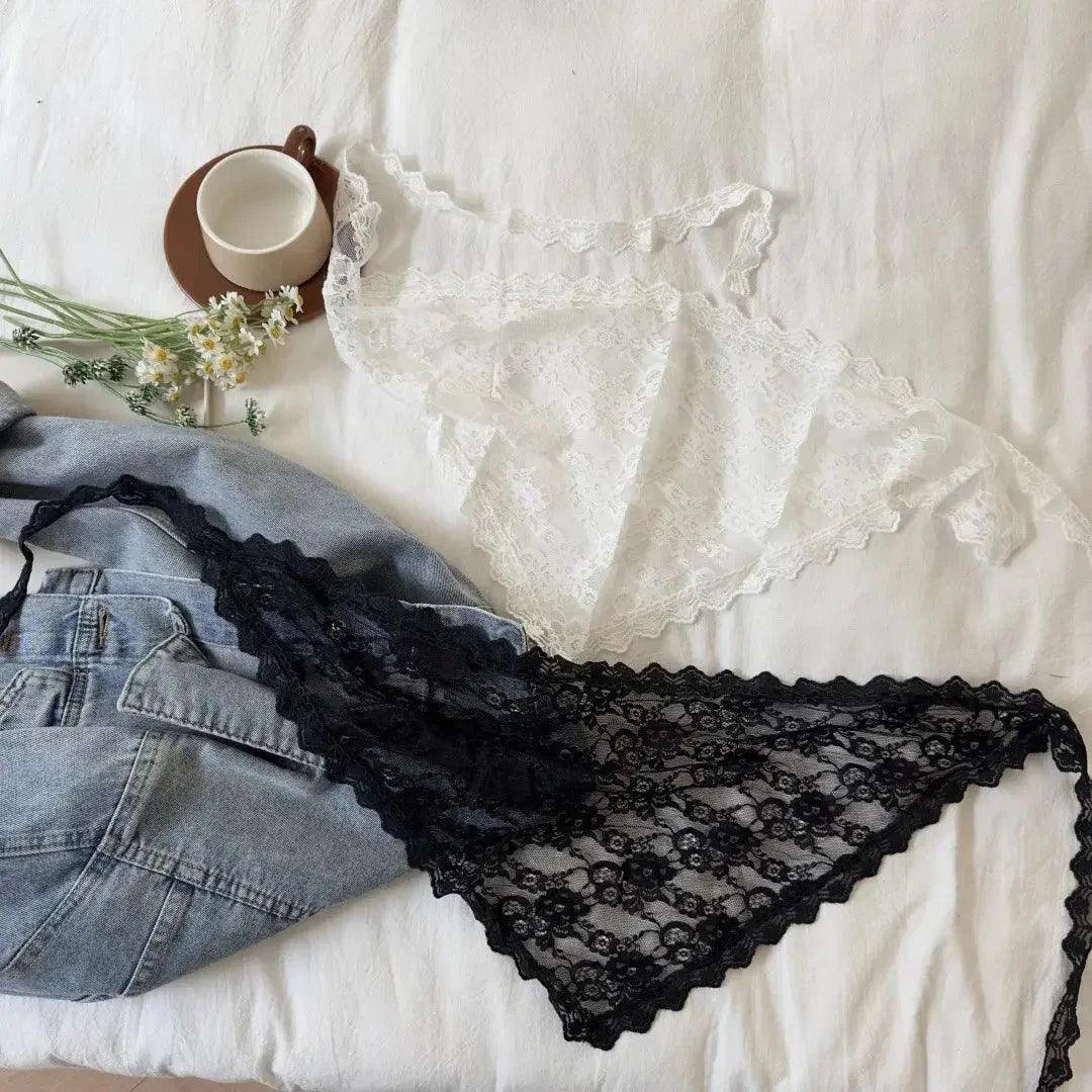 Black and white lace lingerie set with denim shorts, styled on white bedding with coffee cup and flowers
