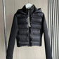 Black women's hooded puffer jacket with long sleeves, displayed on hanger for fashion store