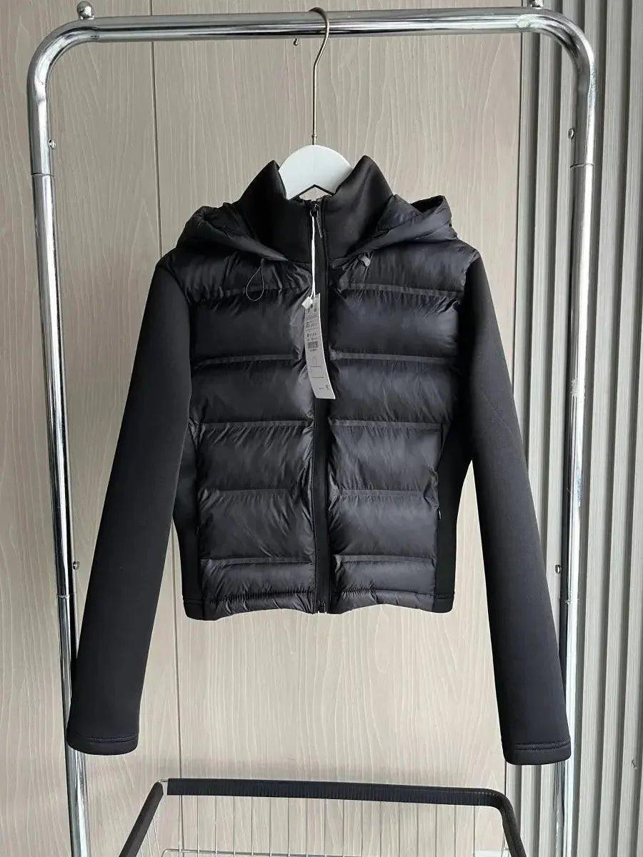 Black women's hooded puffer jacket with long sleeves, displayed on hanger for fashion store