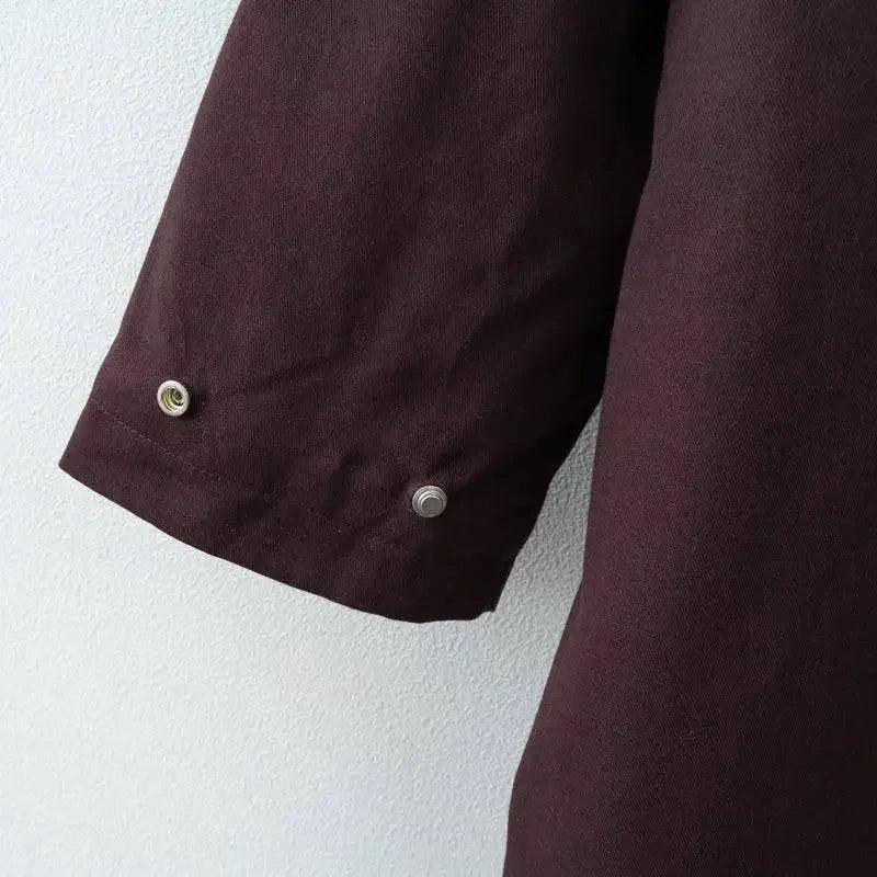 Dark burgundy women's shirt sleeve with button detail, fashion apparel