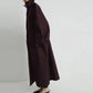 Woman in elegant burgundy trench coat, stylish fashion outerwear for modern wardrobe