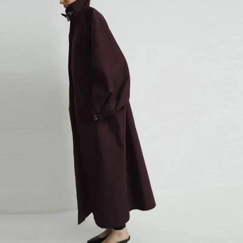 Woman in elegant burgundy trench coat, stylish fashion outerwear for modern wardrobe