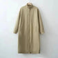 Beige long women's coat with stand collar and side pockets, minimalist fashion outerwear
