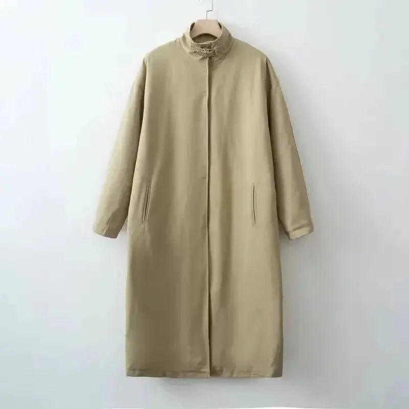 Beige long women's coat with stand collar and side pockets, minimalist fashion outerwear