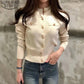Cream button-up cardigan with gold buttons, women's fashion top paired with jeans
