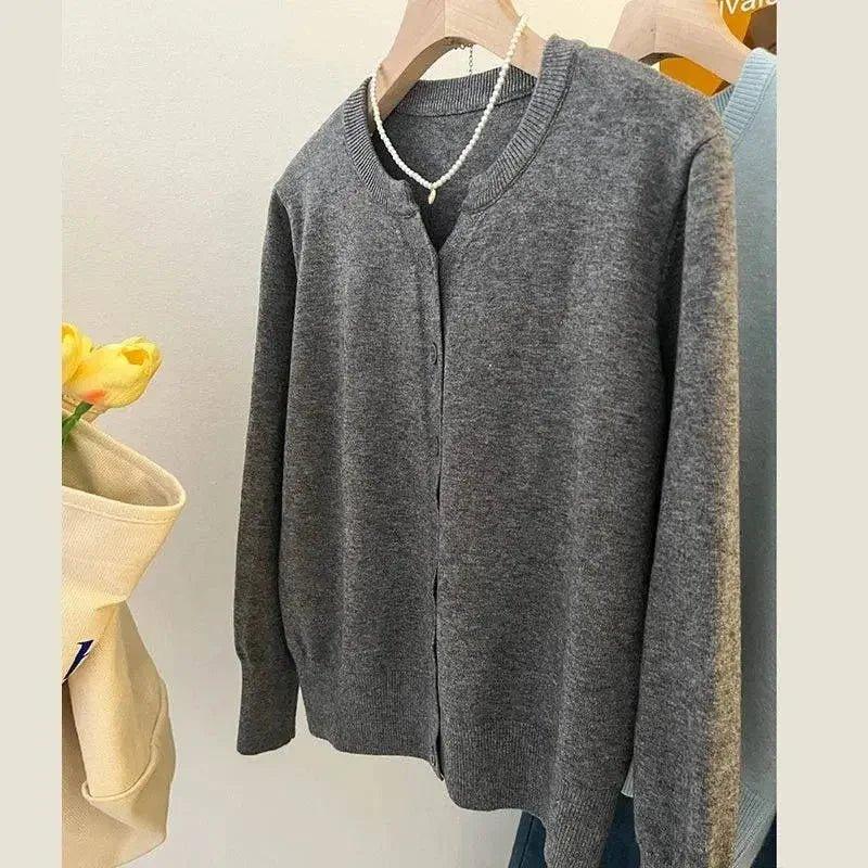 Gray V-neck cardigan sweater with pearl necklace, women's fashion, cozy knitwear style