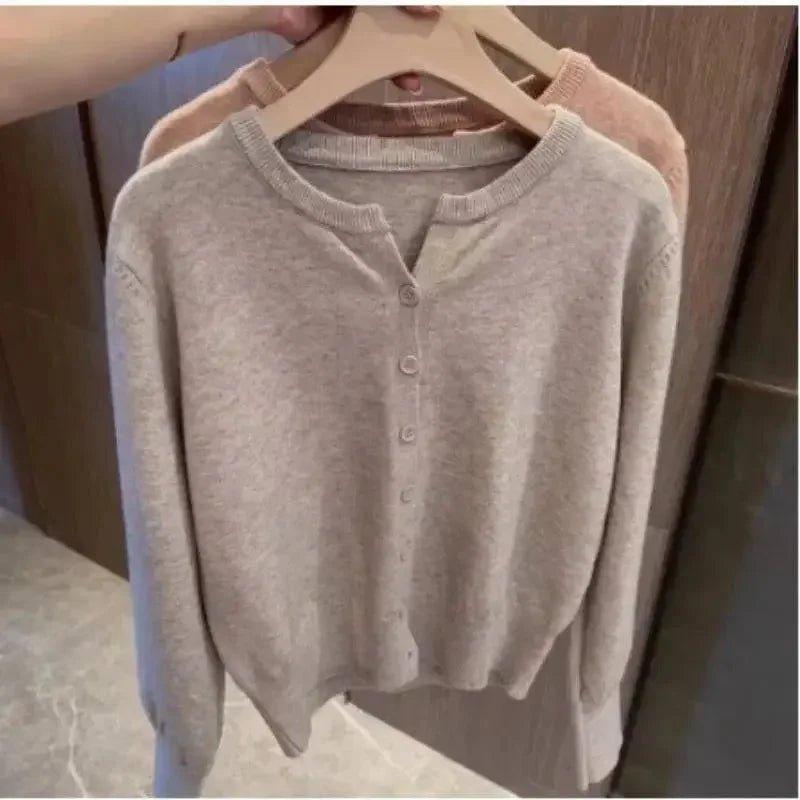Soft beige women's cardigan sweater with button front, cozy knitwear for casual fashion
