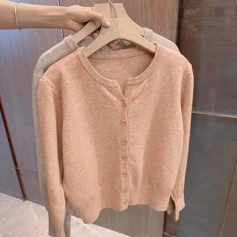 Soft peach button-front cardigan sweater, women's fashion, cozy knitwear for casual style
