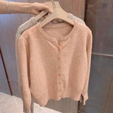 Soft peach button-front cardigan sweater, women's fashion, cozy knitwear for casual style
