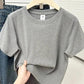Gray women's basic t-shirt on hanger, casual fashion top