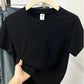 Black women's basic t-shirt on hanger, casual fashion top