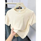 Cream women's cropped t-shirt with round neck, soft fabric, casual summer top for fashion outfits