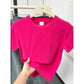 Bright pink women's short sleeve t-shirt on hanger, casual fashion top