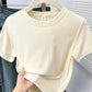 Cream cropped women's t-shirt on hanger, casual fashion top for summer outfits