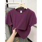 Purple women's crop top t-shirt on hanger, casual fashion style