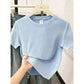 Light blue women's short sleeve t-shirt on hanger, casual fashion top