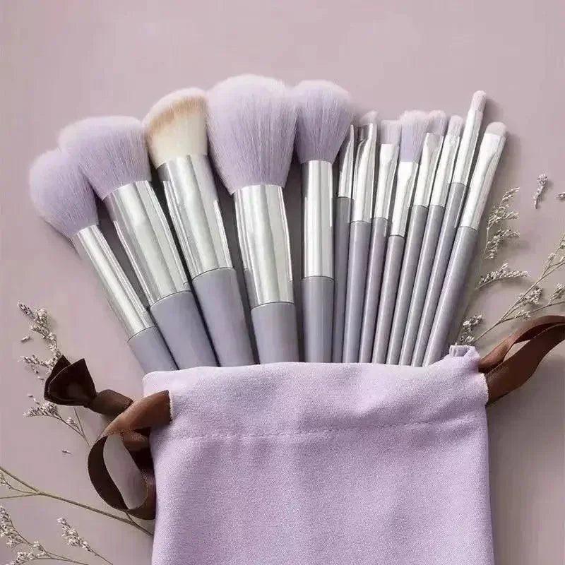Lavender makeup brush set with silver handles in a matching pouch, perfect for beauty and fashion lovers