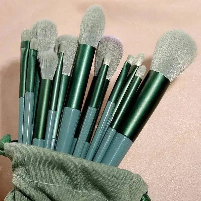 Green and gray makeup brushes set in fabric pouch, beauty tools for face and eyes