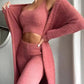 Pink fuzzy women's lounge set with crop top, high-waist pants, and open cardigan for cozy fashion