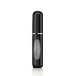 Sleek black perfume atomizer with silver accent, portable fragrance spray for women's fashion