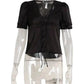 Black lace-trimmed blouse with puff sleeves and front buttons on mannequin