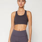 Woman in gray sports bra and high-waisted leggings, fitness apparel for gym or yoga