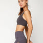 Woman in gray sports bra and high-waisted leggings, fitness fashion