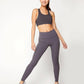 Woman in gray sports bra and high-waisted leggings, fitness activewear for gym or yoga