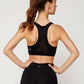 Woman in black sports bra and leggings, back view, fitness activewear