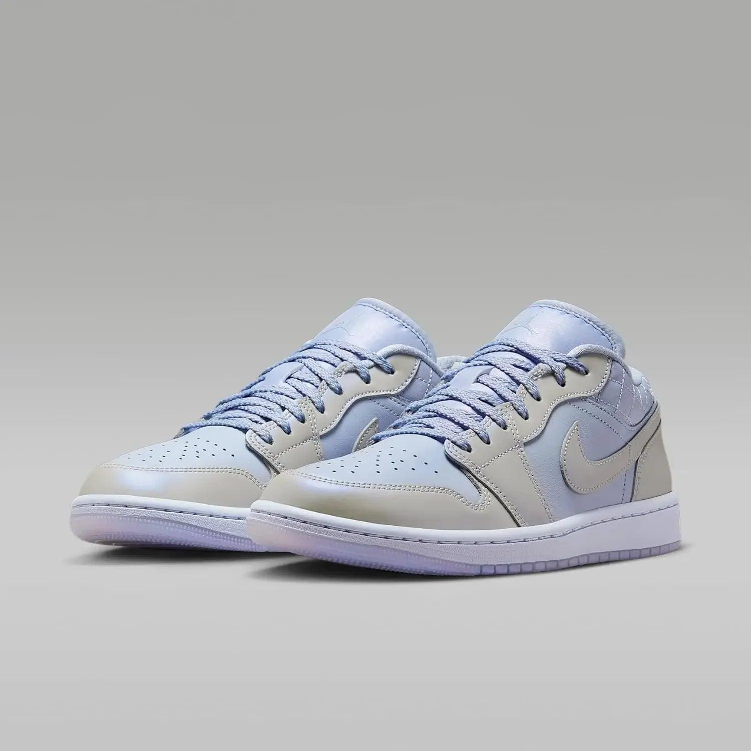 Light blue and white women's low-top sneakers with Nike swoosh, perfect for casual fashion