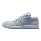 Light blue and cream women's low-top sneaker with quilted details and Nike swoosh