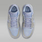 Light blue and beige women's Jordan sneakers with white laces and perforated toe box