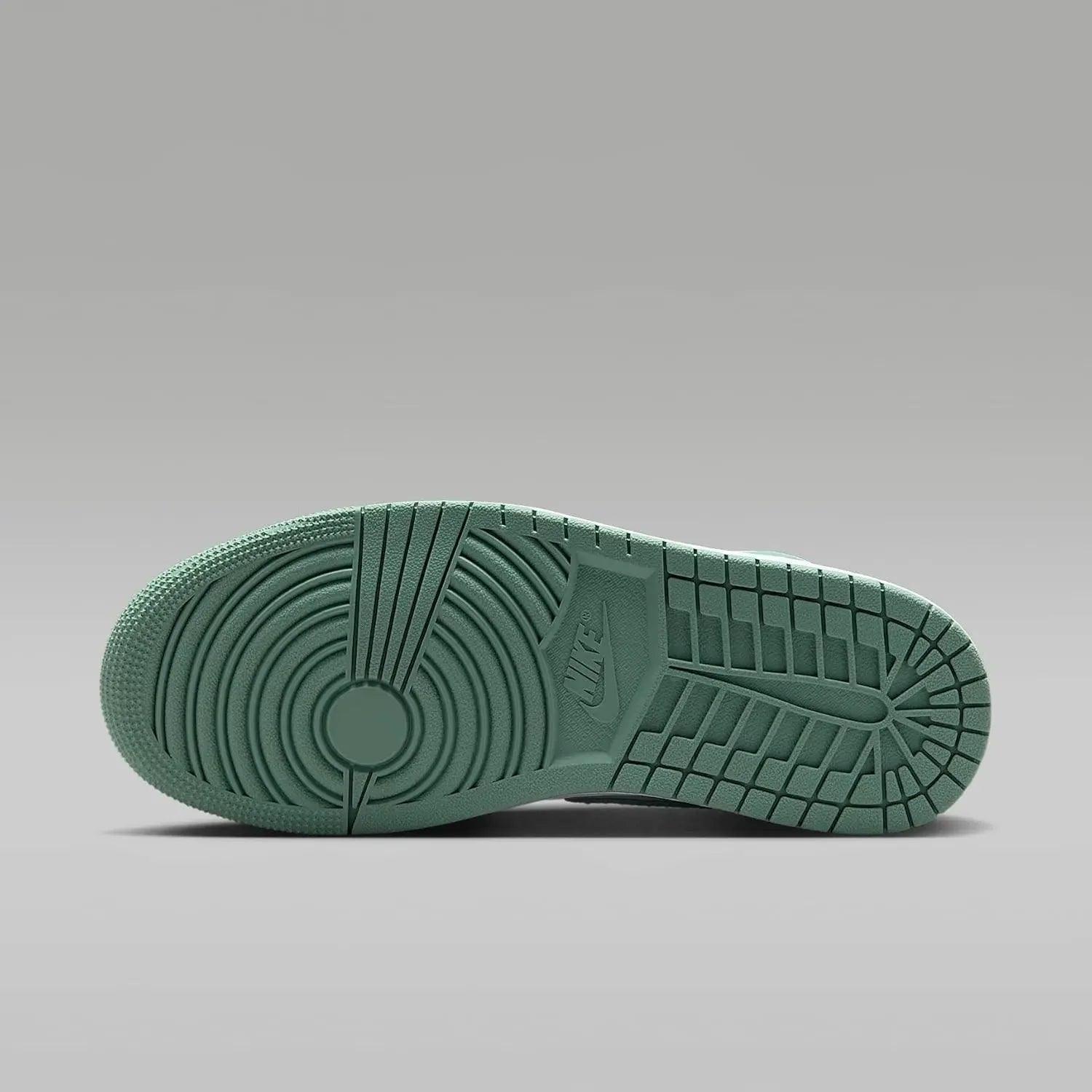 Nike sneaker sole in mint green with iconic tread pattern and logo, women's fashion footwear