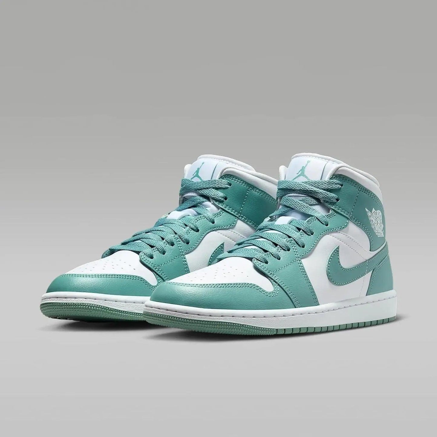 Teal and white high-top sneakers with gum sole and Nike swoosh, stylish women's fashion footwear