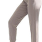 Women's gray jogger pants with drawstring waist, paired with white sneakers for casual fashion