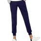 Navy blue women's jogger pants with elastic cuffs, paired with white sneakers and a casual top