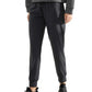 Black jogger pants with drawstring waist, paired with gray sweatshirt and black sneakers for casual fashion