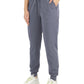 Gray women's jogger pants with drawstring waist, side pockets, and cuffed ankles, paired with white sneakers