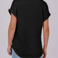 Black women's oversized t-shirt with rolled sleeves and curved hem, back view