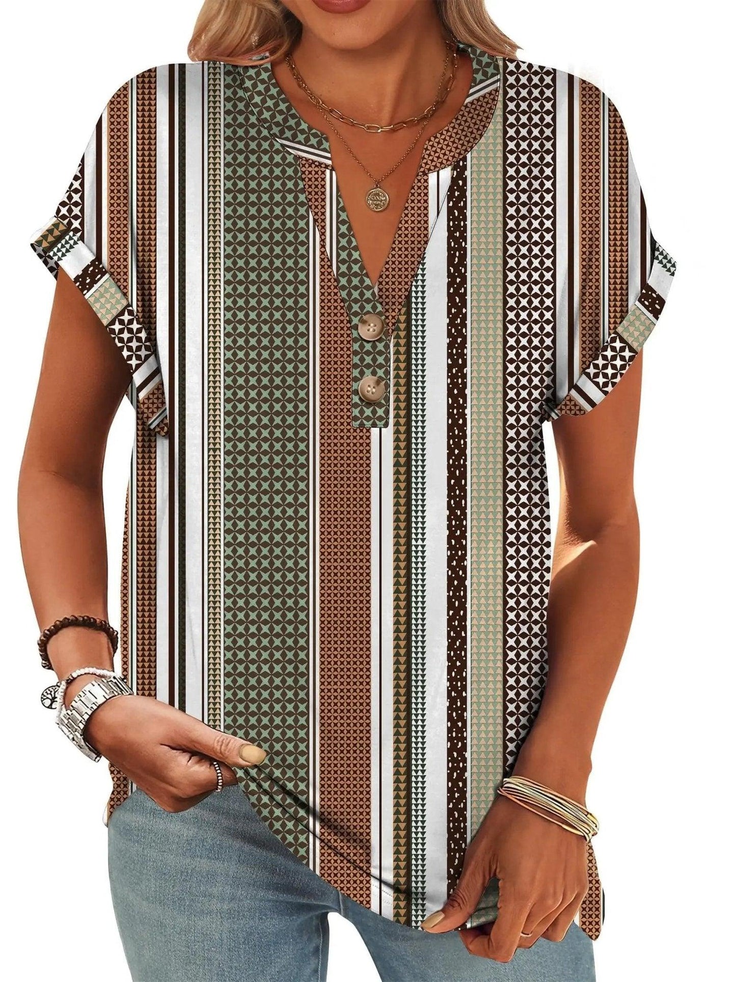 Women's patterned short sleeve blouse with geometric stripes and button front, paired with jeans