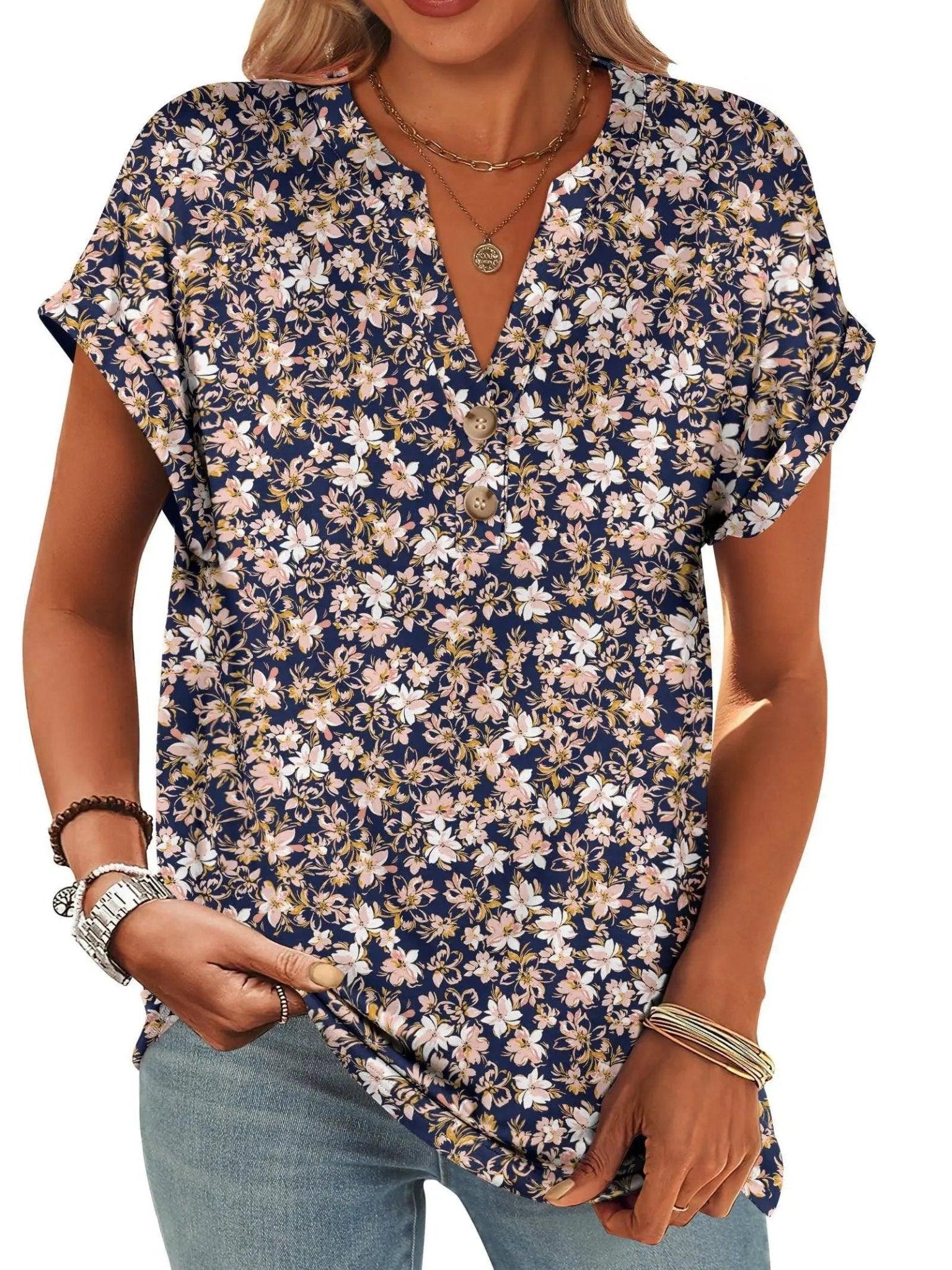 Women's navy floral print V-neck blouse with short sleeves and button front, paired with jeans