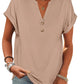 Beige women's V-neck button-up t-shirt with rolled sleeves, paired with jeans and layered necklaces for casual fashion.