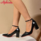 Black patent leather pumps with ankle strap and red sole, women's fashion heels
