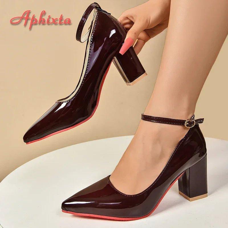 Women's glossy burgundy pumps with ankle strap and red sole, stylish high heels for fashion